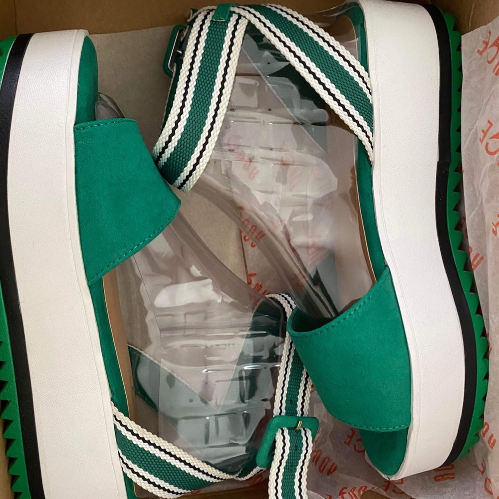 These are a beautiful green platform sandal. Never Worn as you can tell.
